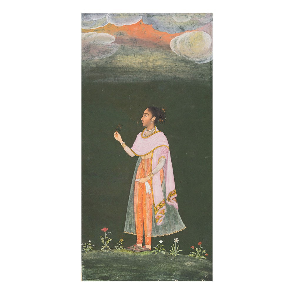 A woman at the court of bikaner holding a flower